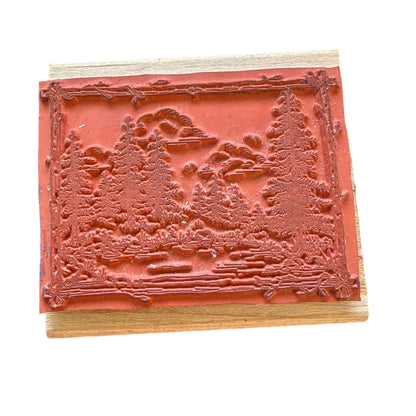 Wooden stamp with a landscape design on a white background