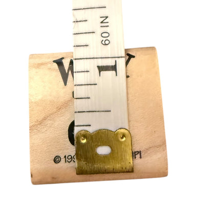 Wood block measuring tape on a white background