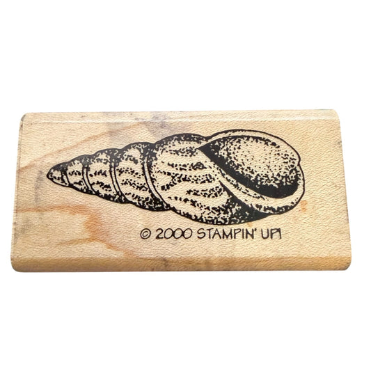 Wooden stamp with a shell design and '2000 Stampin' Up!' text on a white background