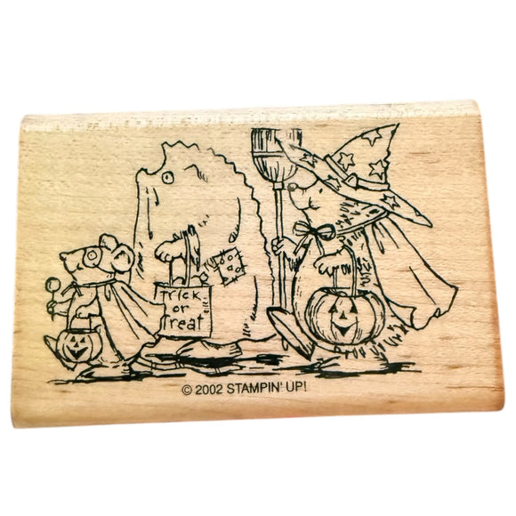 Wooden stamp with Halloween-themed design featuring a witch and pumpkins, branded 'Stampin' Up!'