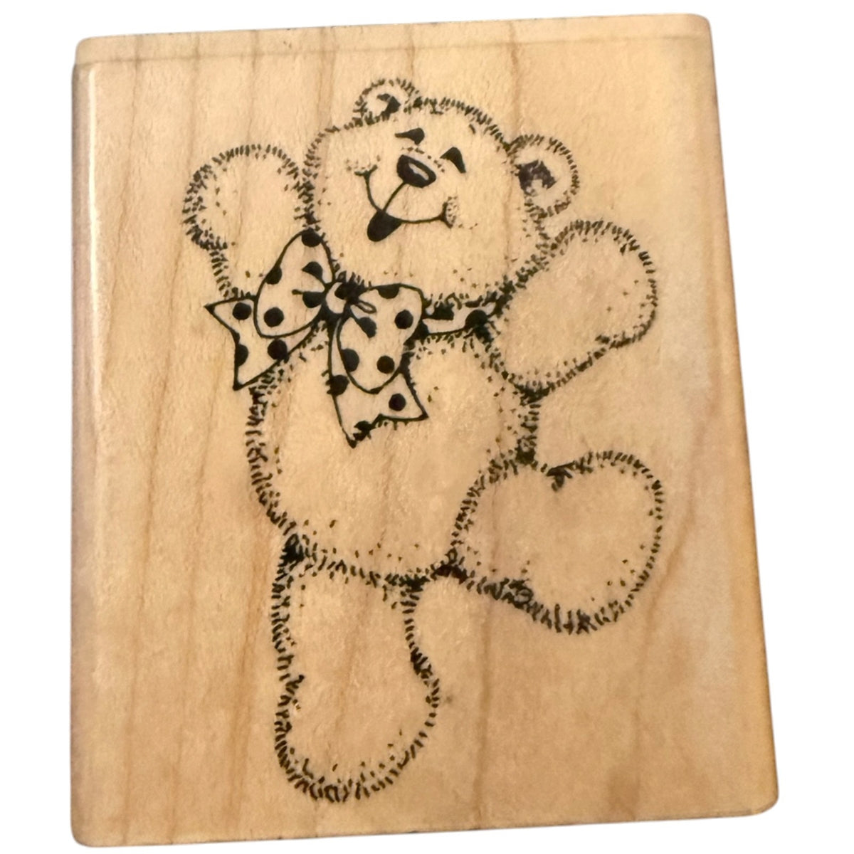 A square wood stamp featuring a black  teddy bear design with a polka-dot bow, shown on a plain white background.