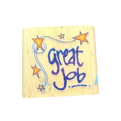 Wooden block with 'great job' text and stars on a white background