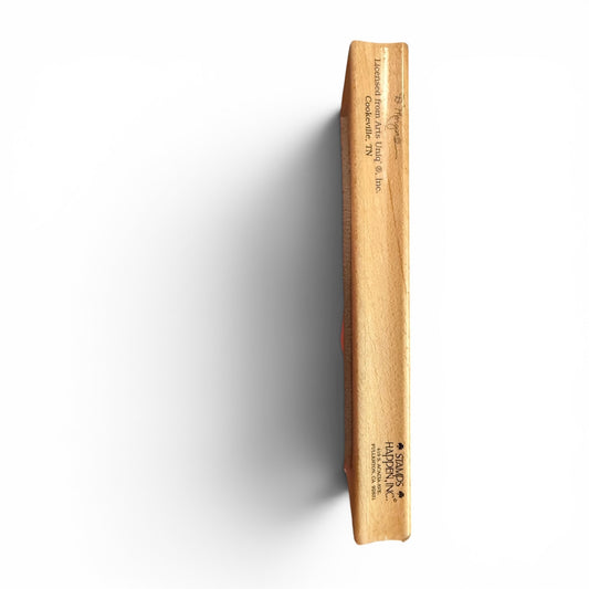 Wooden product with 'Stamps Happen' branding on a white background