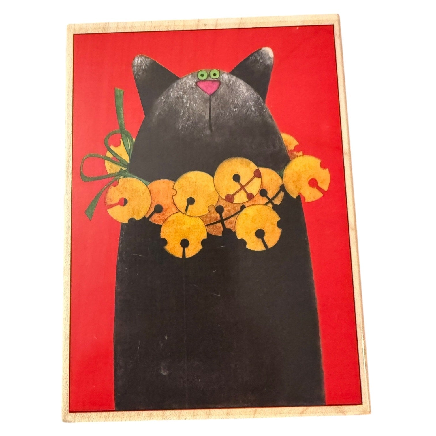 Black cat with bells stamp on a red background