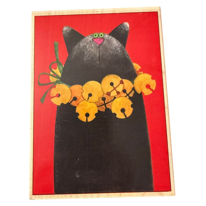 Black cat with bells stamp on a red background