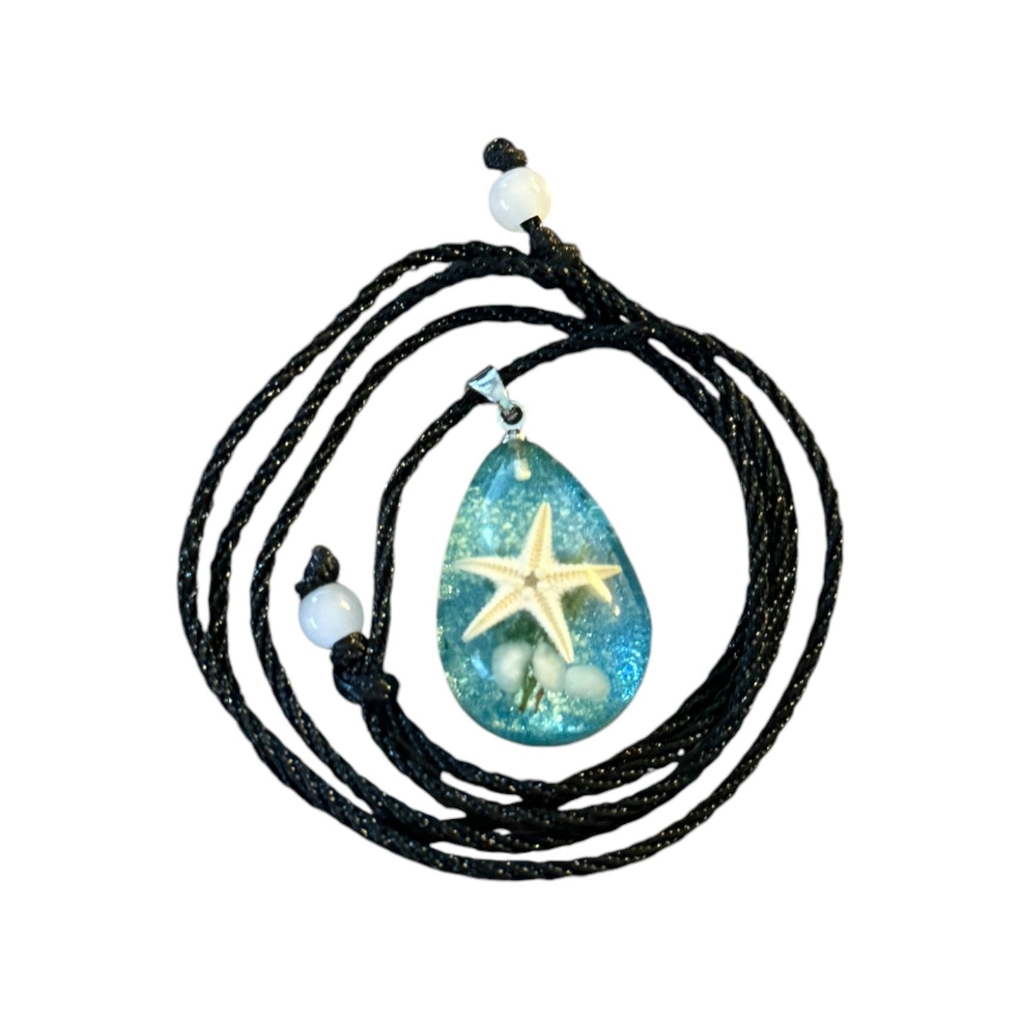 Necklace with a teardrop-shaped pendant featuring a starfish design on a white background