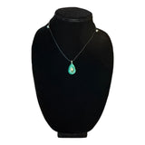Blue green starfish necklace on neck