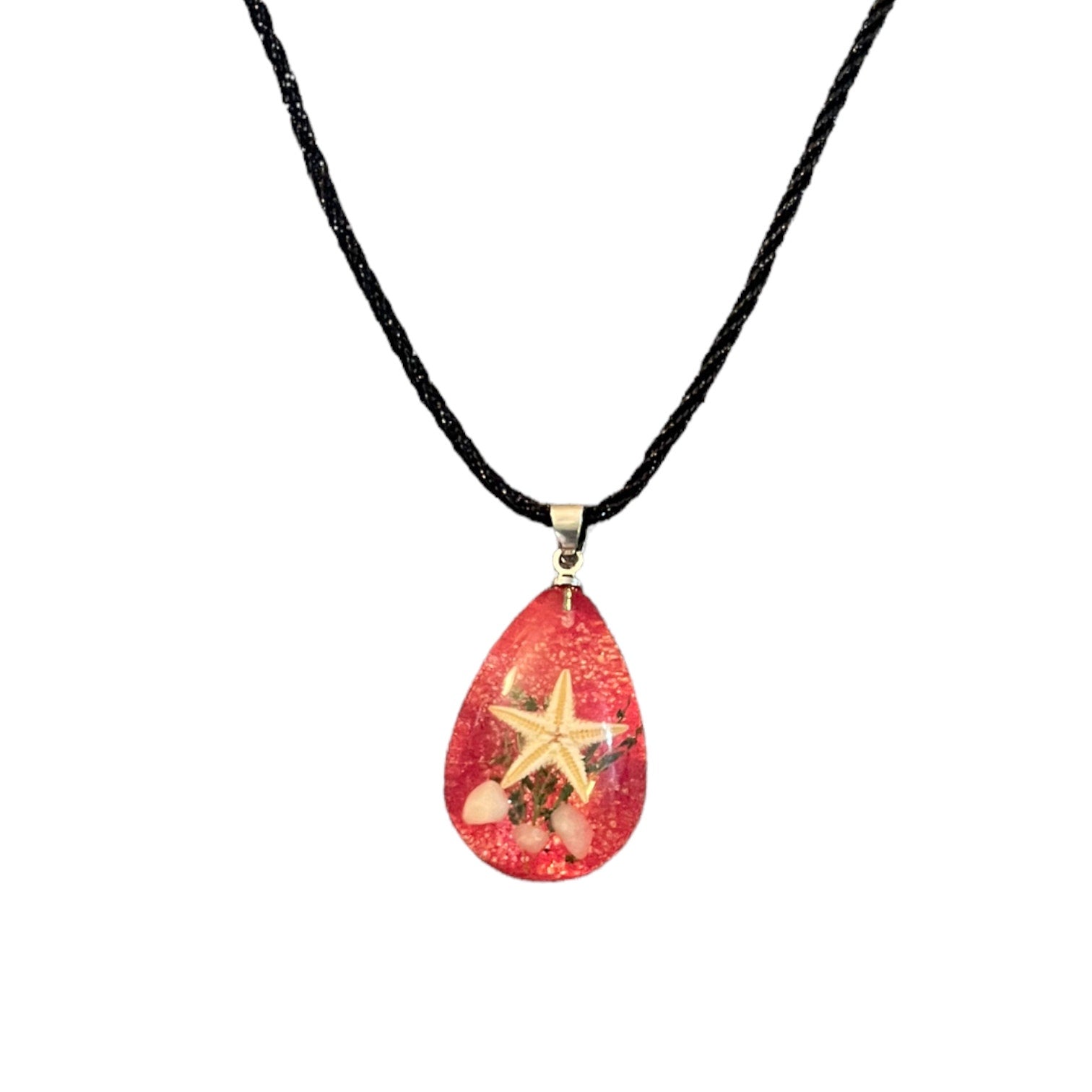 Necklace with a teardrop-shaped red pendant featuring a star design on a white background