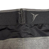 Close-up of a black and gray waist trainer with a brand logo on a white background