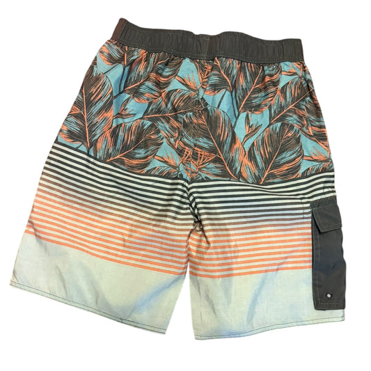 Back of shorts with tropical leaf pattern and striped design on a white background