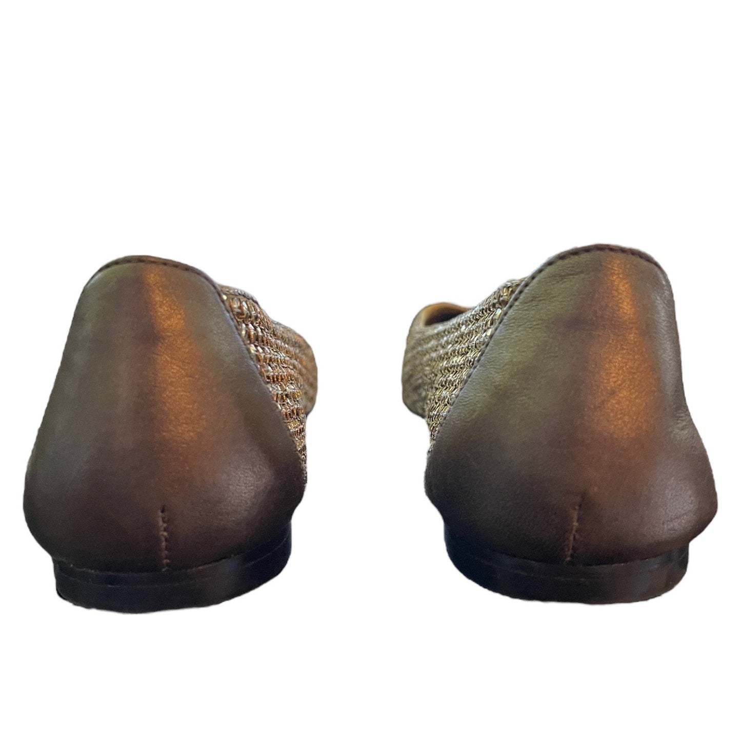 Back of shoes with a leather backing shown on a white background