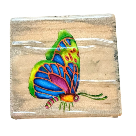 Colorful butterfly design on a wooden block