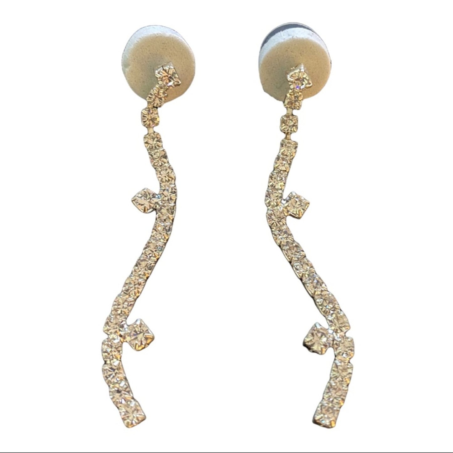 Pair of silver dangle earrings with intricate designs on a white background