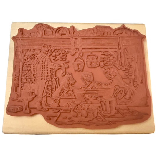 A terracotta-colored rubber stamp , mounted on a rectangular beige wooden block against a white background.