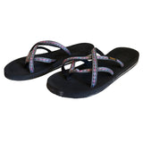 Front side of black flip flops with colorful straps on a white background