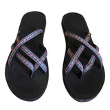 Front of black flip flops with colorful straps on a white background