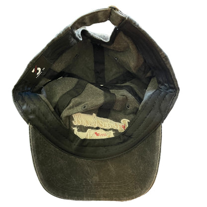 Bottom of cap with a logo on the inside against a white background