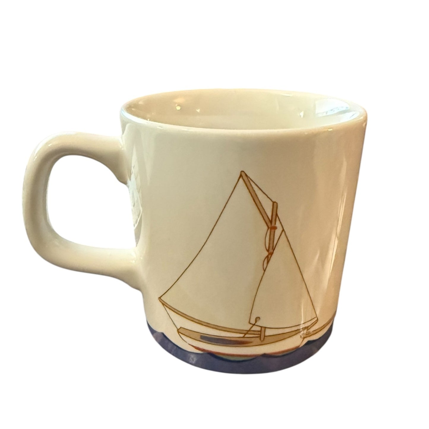 Mug with a sailboat design on a white background