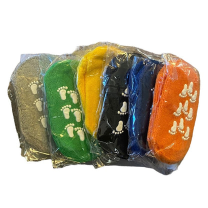 Packaged colorful footie socks with footprints on a white background