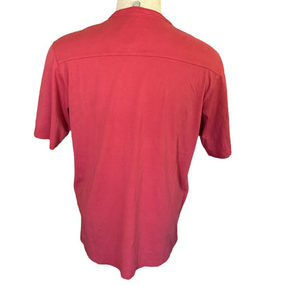 Red shirt on a mannequin with a white background