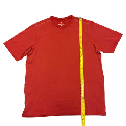 Red t-shirt with a measuring tape on a white background
