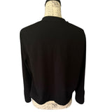 Back of black cardigan on a mannequin with a white background