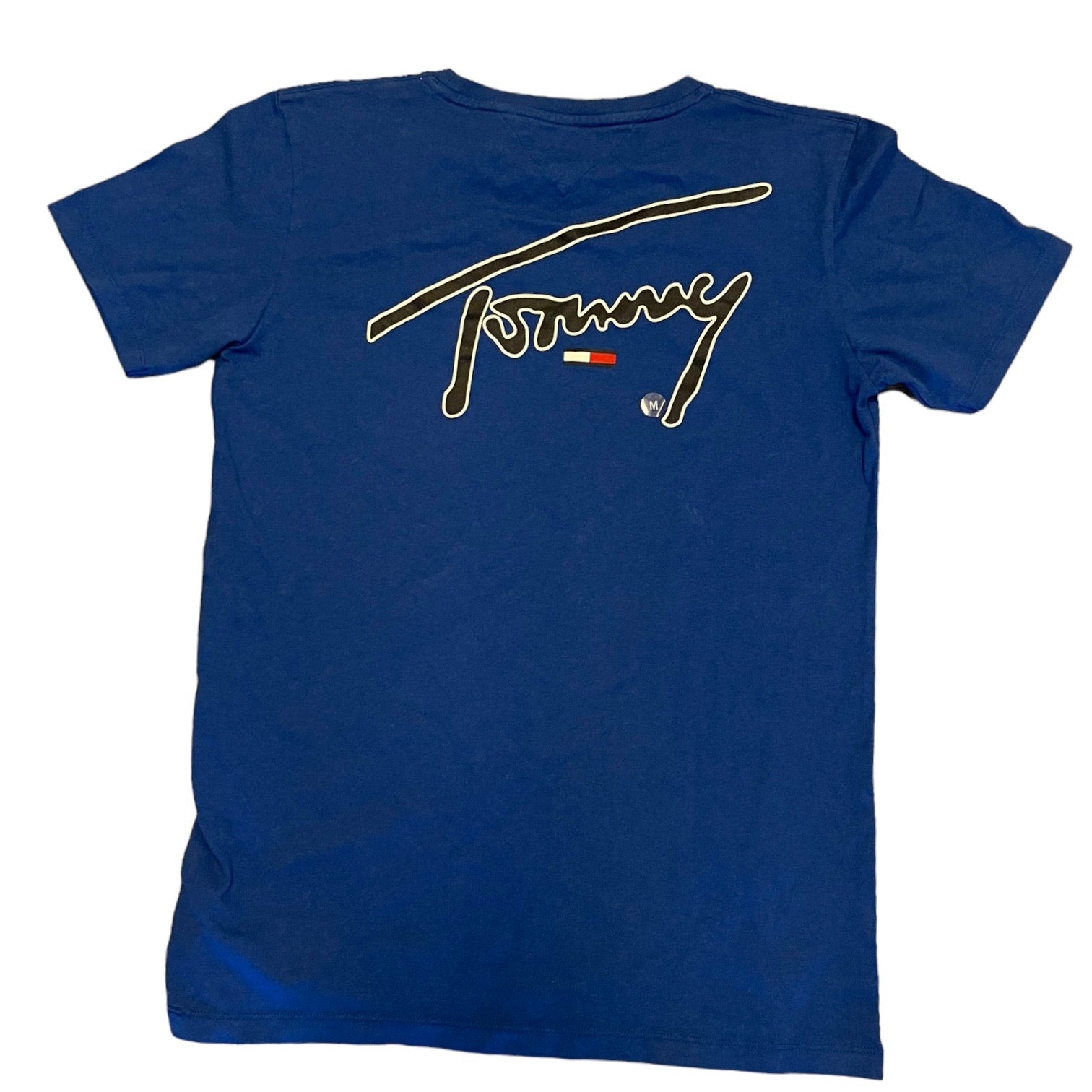 Back of Blue t-shirt with Tommy Hilfiger logo on the back against a white background