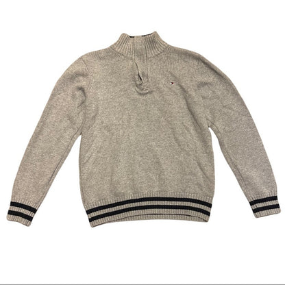 Gray sweater with black ribbed cuffs and hem on a white background
