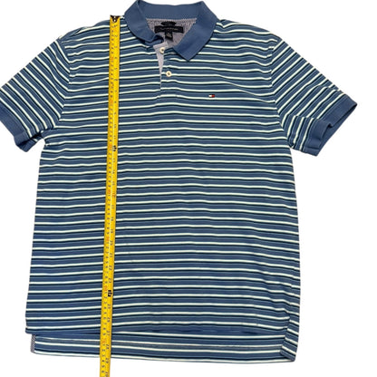 Blue and white striped polo shirt with a measuring tape on a white background