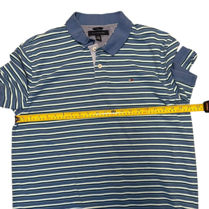 Blue and white striped polo shirt with a measuring tape on a white background