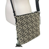 Crossbody bag with TH pattern on a mannequin against a white background