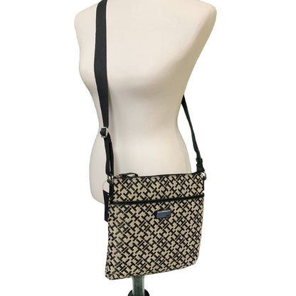 Patterned crossbody bag on a mannequin with a white background