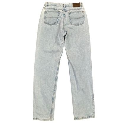 Light wash blue denim jeans shown from the back, featuring a classic five-pocket design and a brown leather brand patch at the waistband.