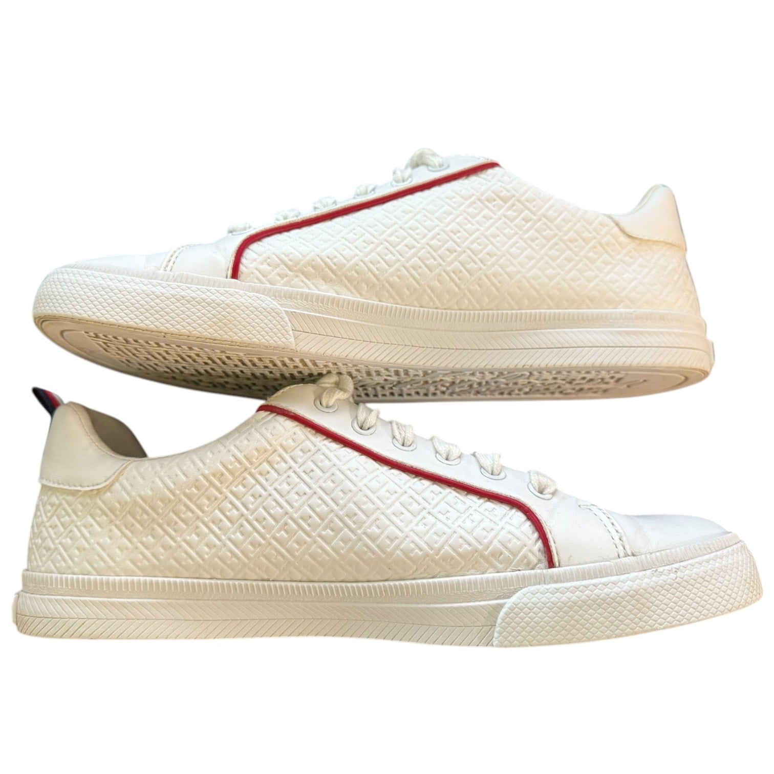 White sneakers with red accents on a white background