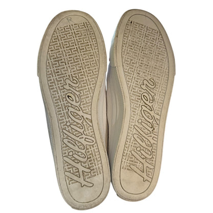 White shoe soles with brand logo on a white background