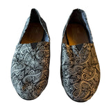 Front Pair of black silver paisley patterned loafers on a white background