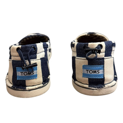 Pair of striped TOMS shoes on a white background