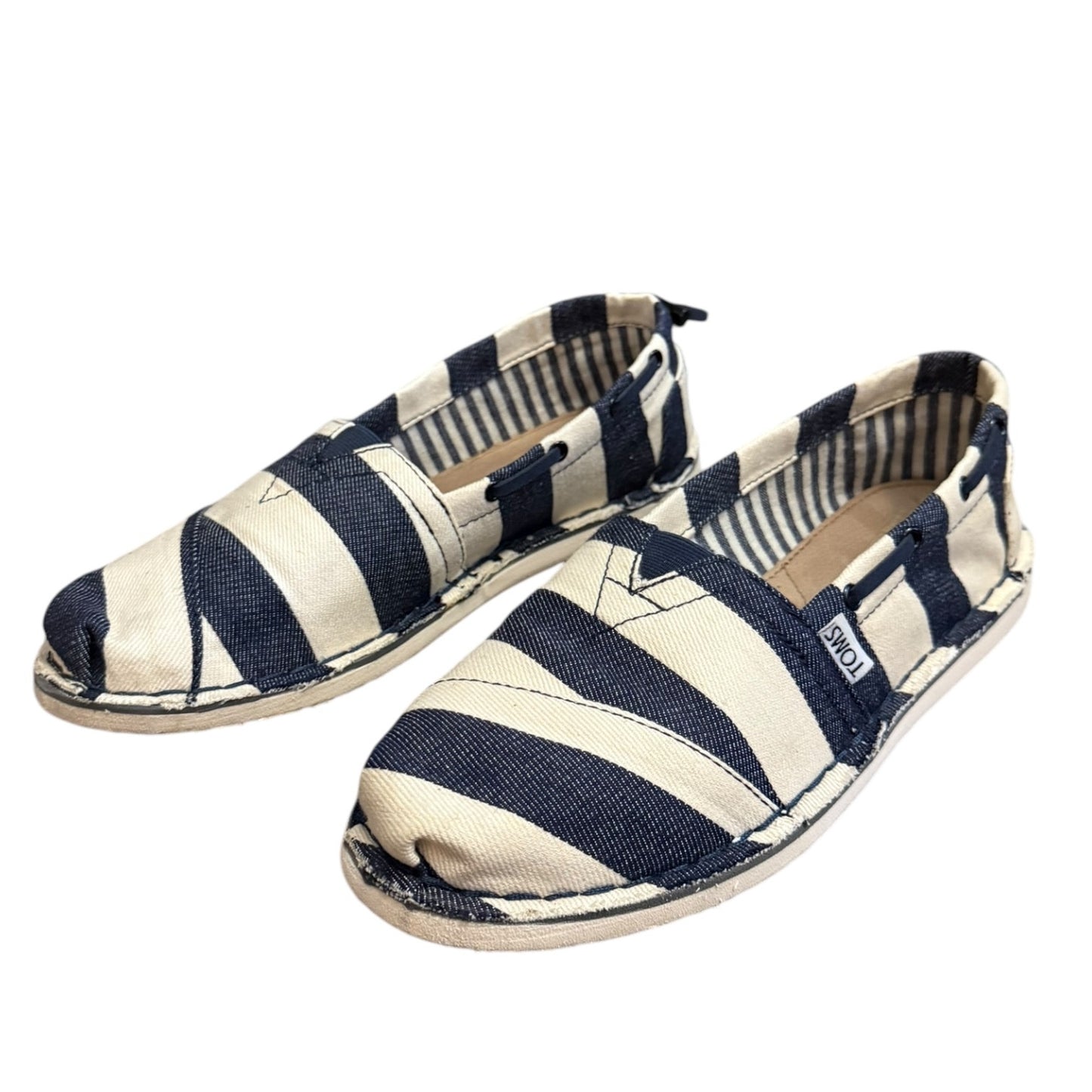 Navy and white striped shoes on a white background