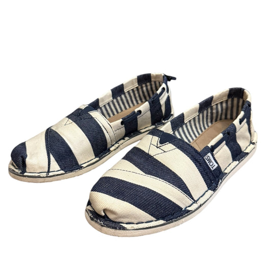 Navy and white striped shoes on a white background