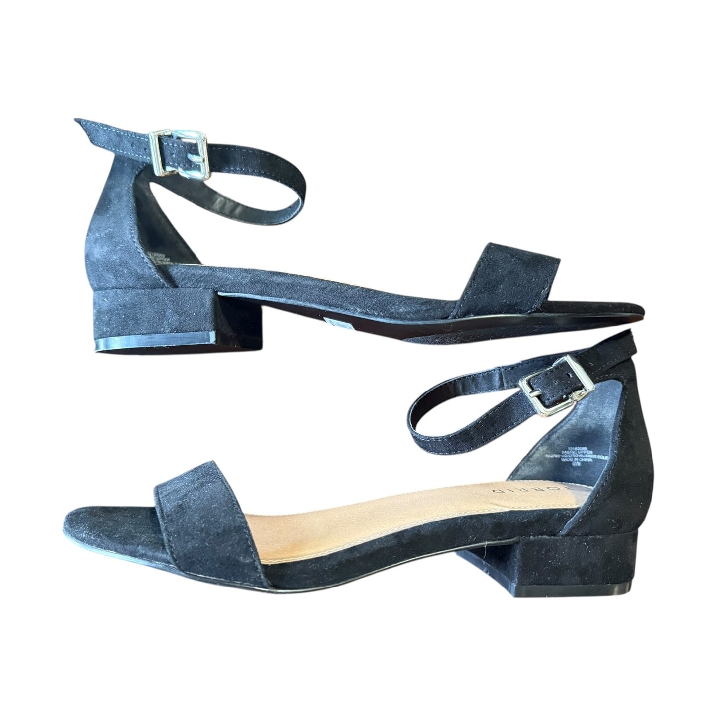 Pair of black faux suede sandals on a white background