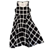 Black and white checkered dress laying flat on a white background