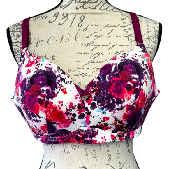 Front of Floral-patterned bra on a mannequin with an old document background