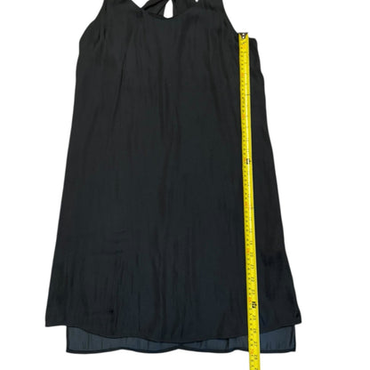 Black dress with a yellow measuring tape on a white background