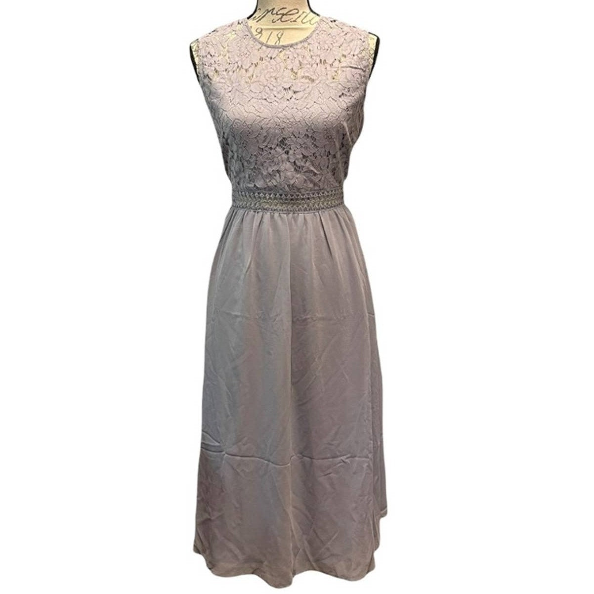 A sleeveless midi dress with a lace bodice and a flowing skirt, shown on a dress form against a plain white background.