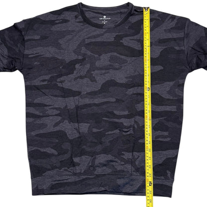 Camouflage sweater with a measuring tape on a white background