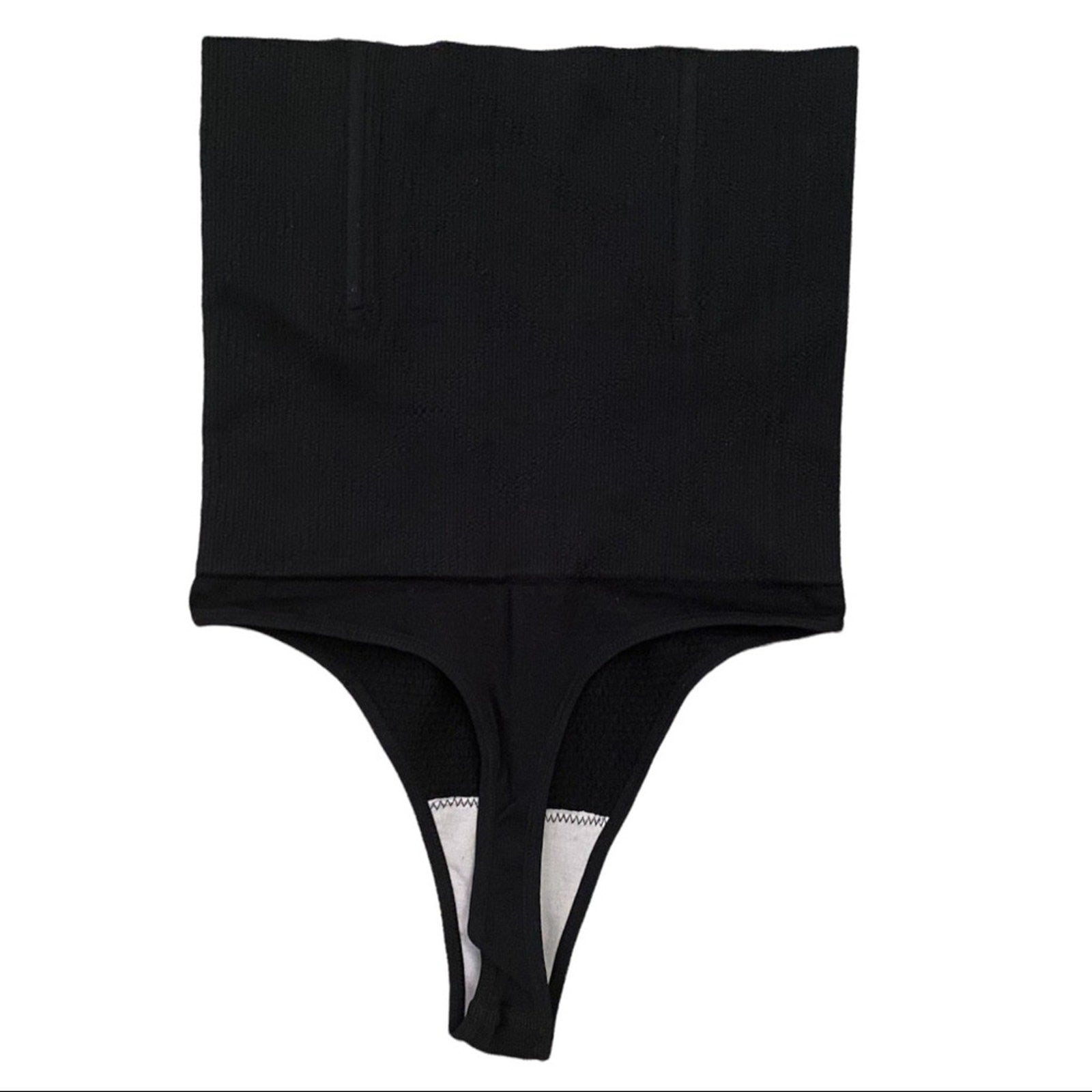Back of black tummy control thong on a white background