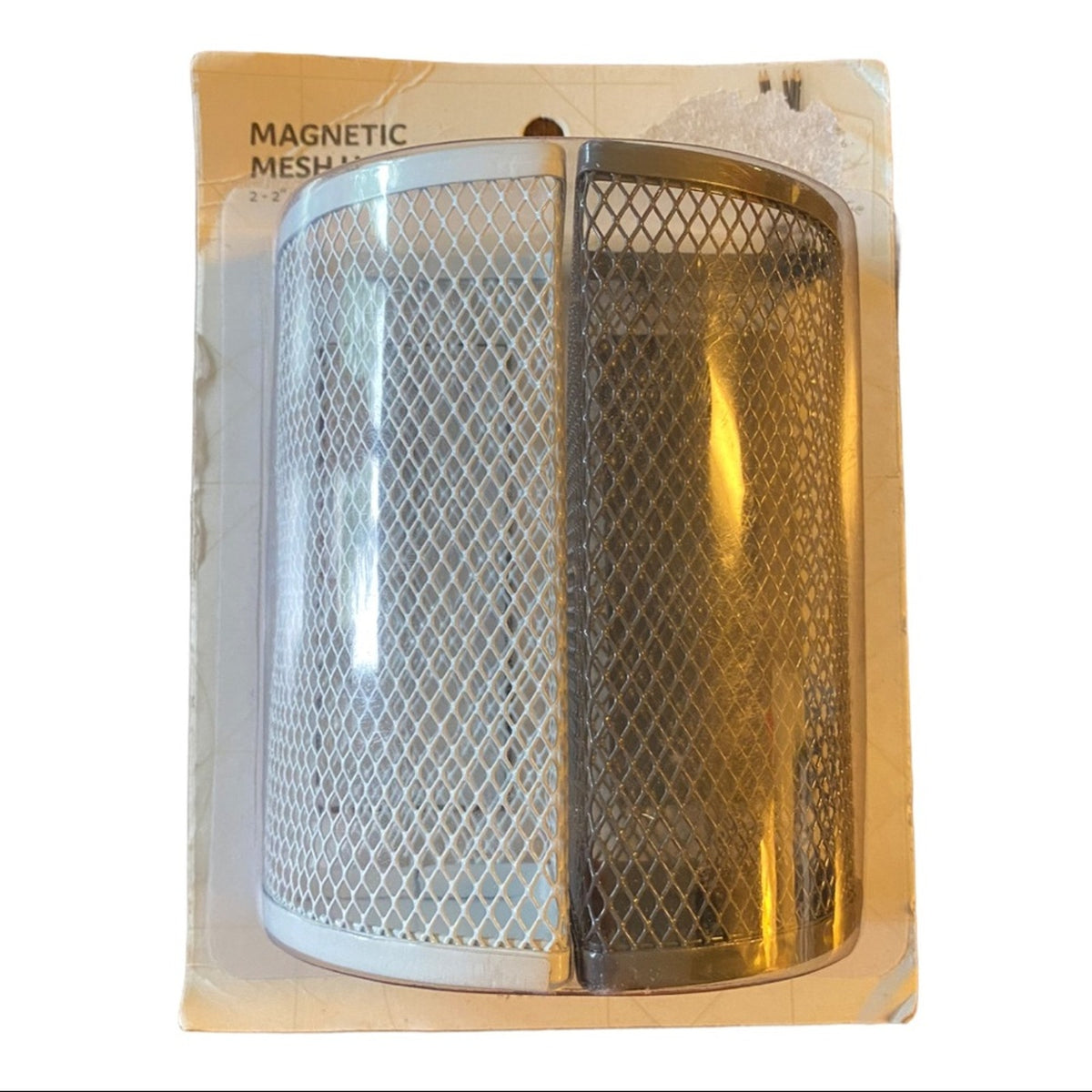 Magnetic mesh container in packaging on a white background