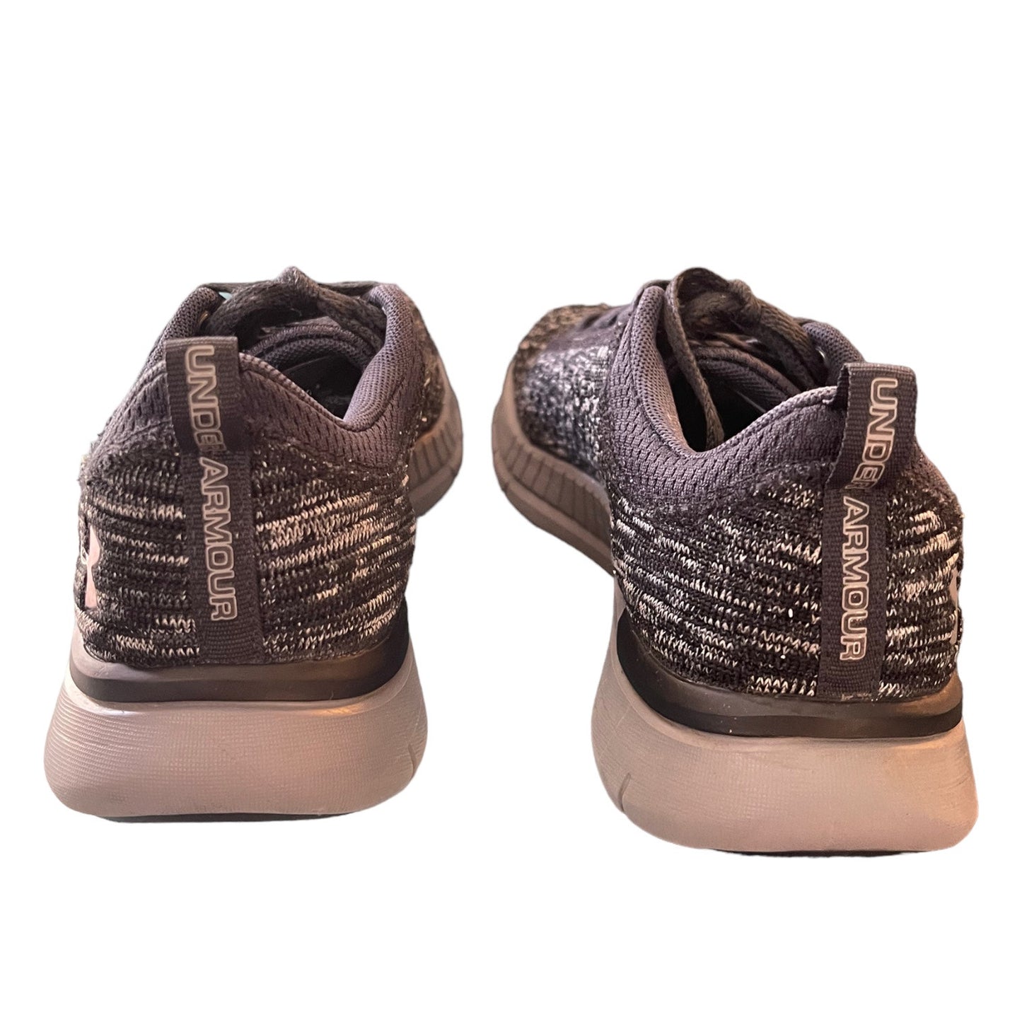 Back of a Pair of Under Armour shoes on a white background