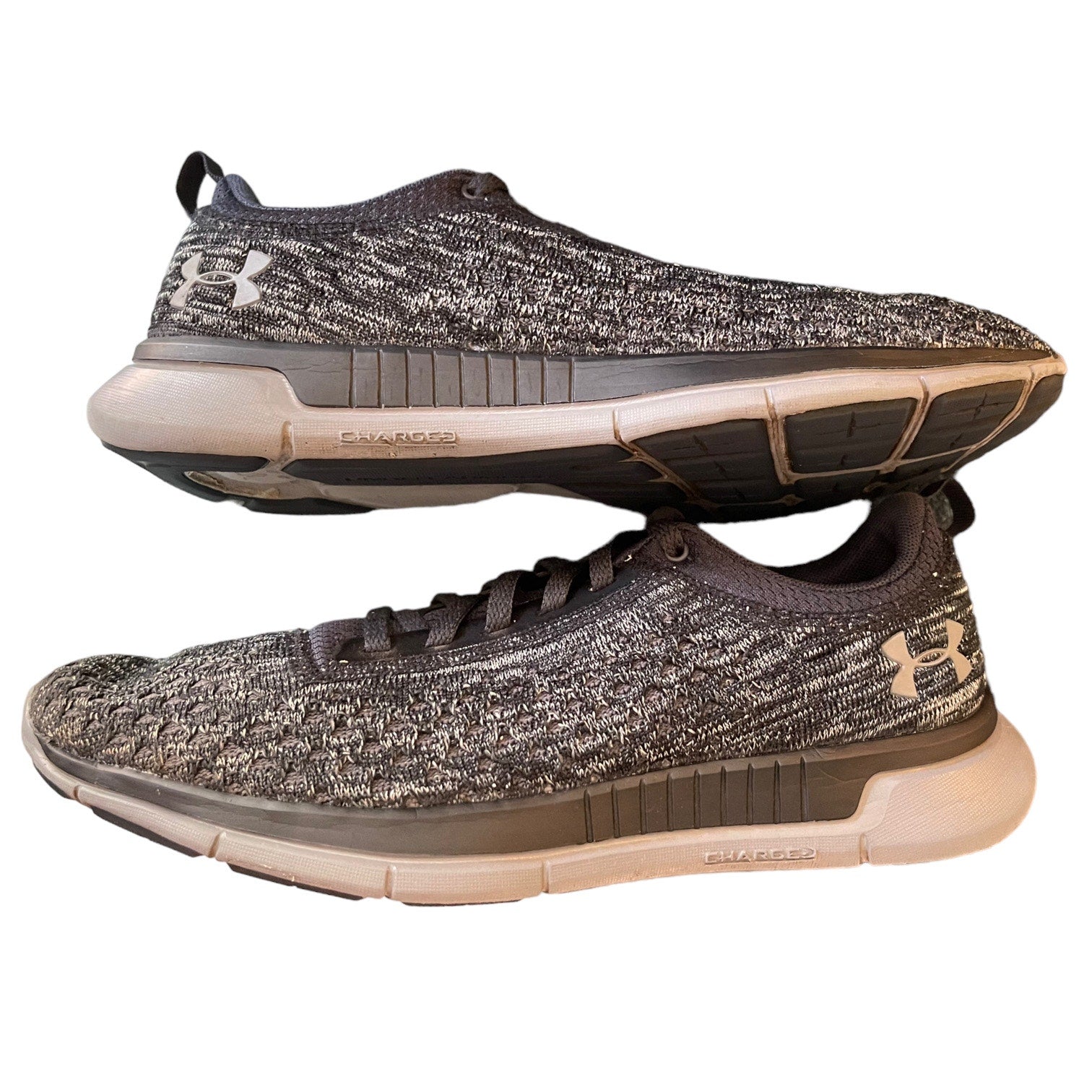 Side of a Pair of Under Armour running shoes on a white background