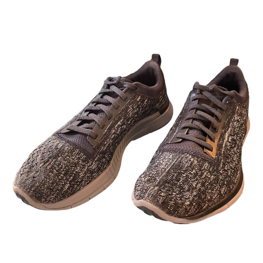 Front side of gray sneakers on a white background